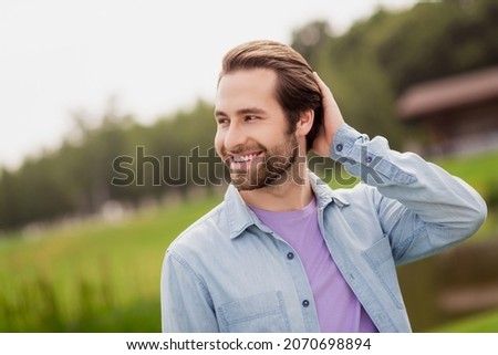 Photo of young good looking positive attractive male relaxing touch hair flirty coquettish enjoying summer vacation