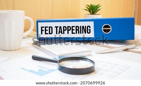 fed tappering words on labels with document binders