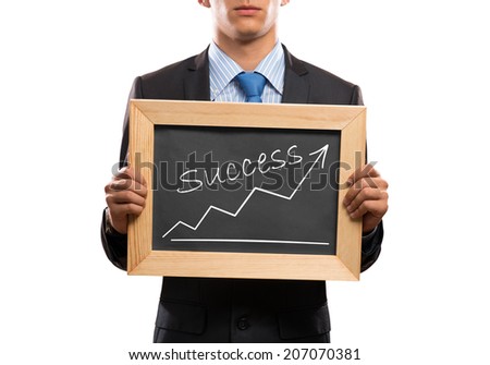 Close up of businessman holding chalkboard with word success