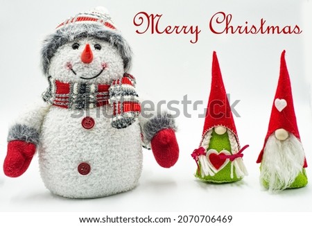 Christmas and New Year decorations. Cute little snowman and gnome on white background.  Merry Christmas and Happy New Year !