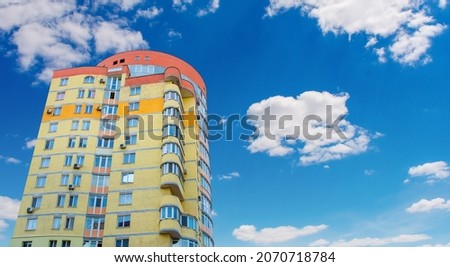 Photo of beautiful red yellow modern apartment building