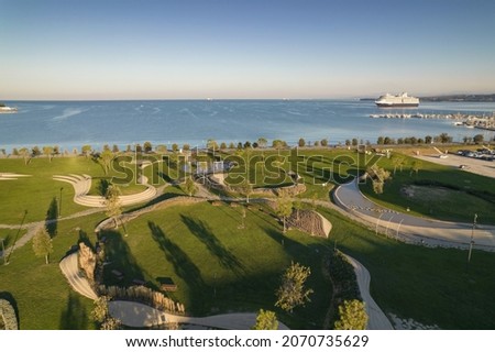 Morning view of park by the sea Royalty-Free Stock Photo #2070735629