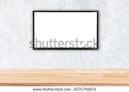 Smart TV with white blank screen on concrete wall in the living room.