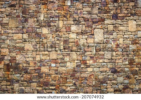 Natural stone wall texture for background Royalty-Free Stock Photo #207074932