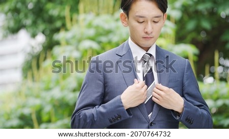 Asian businessman in a suit Royalty-Free Stock Photo #2070764732