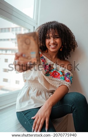 Black woman holding her passport