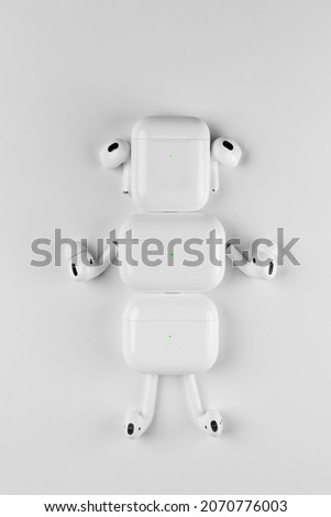 white wireless headphones on background. headphone robot
