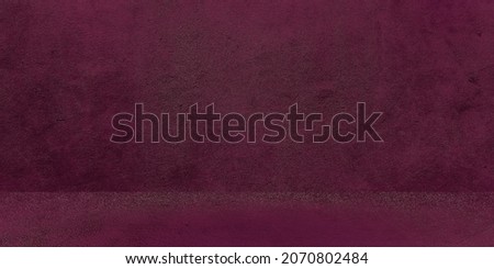 Old shabby concrete wall texture with cracked purple concrete studio wall. Abstract grunge background. Product presentation.