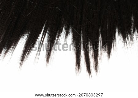 black hair end texture close-up beautiful abstract white backgro Royalty-Free Stock Photo #2070803297