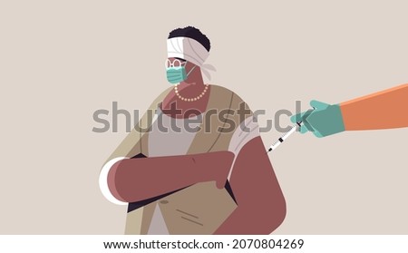 doctor hand vaccinating african american female patient in medical mask fight against coronavirus vaccine development