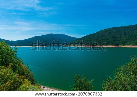 Summer drought conditions in the United States are reflected in low water levels in Palisades reservoir near Alpine, Wyoming, USA Royalty-Free Stock Photo #2070807332