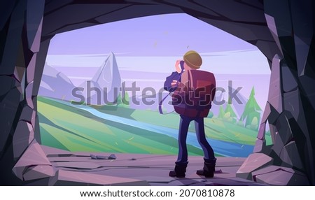 Hiker man taking photo of mountain landscape in cave entrance. Vector cartoon illustration of tourist photographer with camera in stone cavern and scene with rocks, trees and river