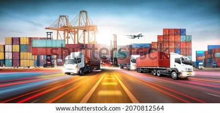 Global business logistics import export and container cargo freight ship during loading at industrial port by crane, container handlers, cargo plane, truck on highway, transportation industry concept Royalty-Free Stock Photo #2070812564