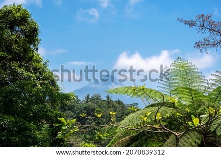 Landscape photo. View of Mount Raung Banyuwangi with blue sky and clouds.