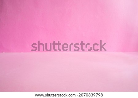 Minimalist Concept of Product Presentation. pink paper background texture.