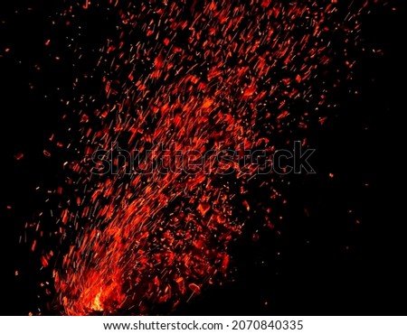 Sparks from fire on a black background.