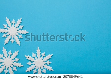 Christmass flatlay white snowflakes in shape frame Royalty-Free Stock Photo #2070849641