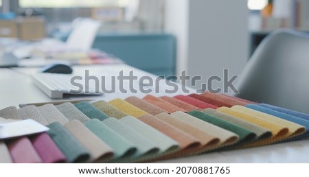 Colorful fabric swatches on a designer desk, home decoration and interior design concept