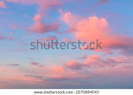 Light pink clouds in sunset blue sky. Pastel colors of clouds, sunrise sundown natural background Royalty-Free Stock Photo #2070884045
