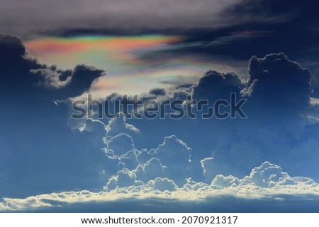 Iridescent Cloud (Cloud iridescence) or irisation is a colorful optical phenomenon that occurs in a cloud.
The colors are usually pastel, but can be very vivid or mingled together.