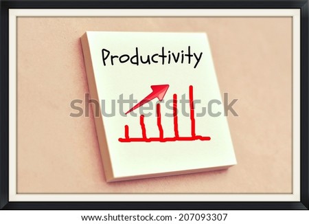 Text productivity go up on the graph on the short note texture background