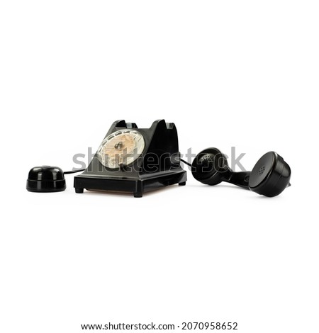 Vintage black bakelite telephone on white background