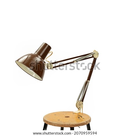 Old Fashioned angle poise lamp on white background Royalty-Free Stock Photo #2070959594