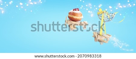 Religion image of jewish holiday Hanukkah background with menorah (traditional candelabra) and doughnut