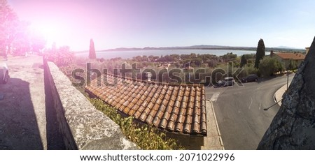 Castiglione del lago Trasimeno, Umbria, Italy. August 2020. Amazing large format panoramic photo of the view of the lake from the walls of the old town.