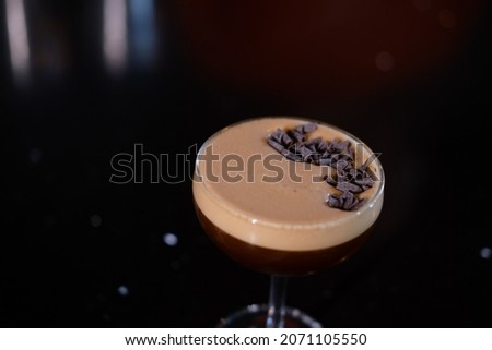 Espresso Martini cocktail garnished with grated chocolate. Alcohol cocktail.