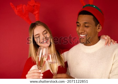 Young people in horned hats celebrating christmas