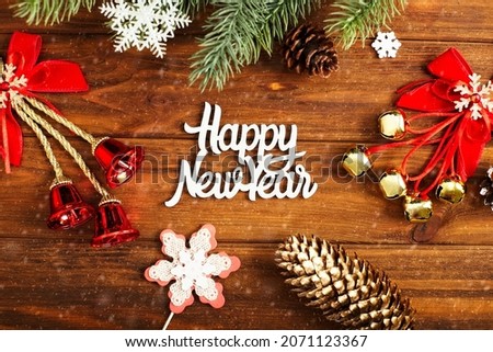christmas or New Year dark wooden background, Xmas black board framed with season decorations, space for a text, view from above