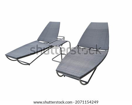 Two large chaise longues by the pool for sunbathing and relaxing on isolated white background. 