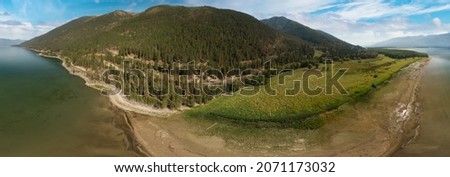 Aerial Panoramic View of a beautiful lake in Canadian Nature Landscape. East Kootenay, British Columbia, Canada. Royalty-Free Stock Photo #2071173032