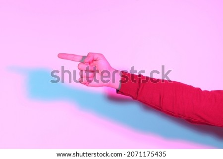 The Asian man hand in the gel color light Photography.