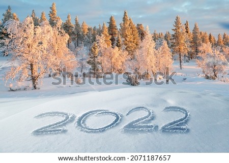 2022 written in the snow, winter landscape greeting card Royalty-Free Stock Photo #2071187657