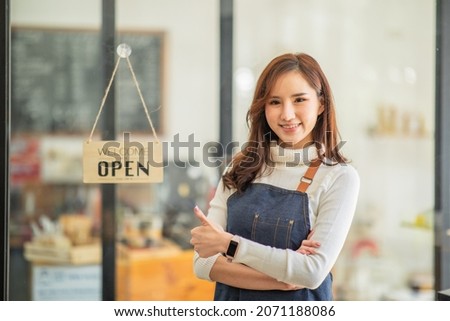 Portrait of Startup successful small business owner in a coffee shop.Asian businesswoman barista cafe owner. SME entrepreneur seller small business concept.