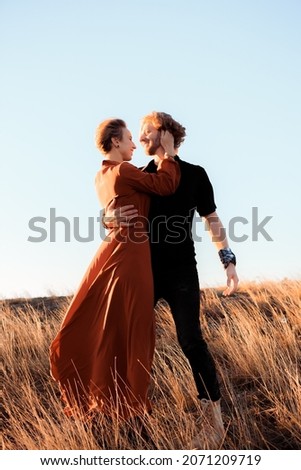 
happy and loving couple in the setting sun