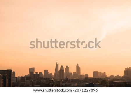 The cityscape and skyscrapers of London during sunset