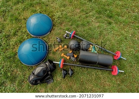 Set of sport professional equipment on lying on green grass