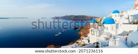 white church belfry, blue domes and volcano caldera with sea landscape, beautiful details of Santorini island, Greece, wide web banner format