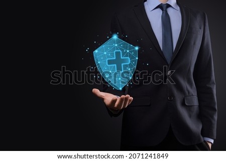Businessman hold Shield with plus Low polygonal icon, medicine icon.Health shield.Medical logo template,protection symbol with cross sign,healthcare security label,Medical logo,life insurance service.