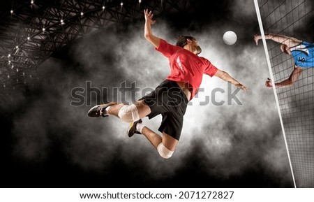 Volleyball player players in action. Sports banner. Attack concept with copy space Royalty-Free Stock Photo #2071272827