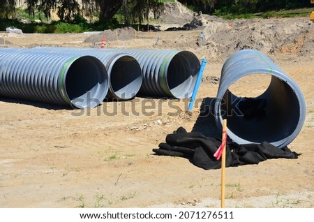 Gray corrugated piping on construction site