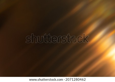 Blur light overlay. Lens flare rays. Defocused glare. Old film flash leak. Bokeh golden orange color beam design glow on dark black abstract background. Royalty-Free Stock Photo #2071280462