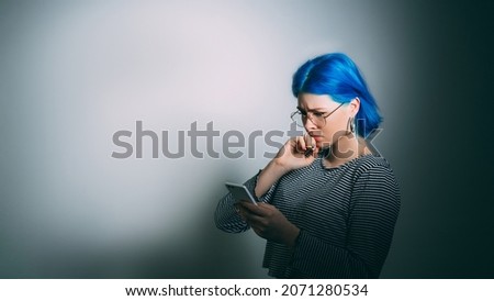 Cyber bullying. Bad news. Internet harassment. Sad depressed woman victim received phone hater abuse message isolated on light gradient empty space background. Royalty-Free Stock Photo #2071280534