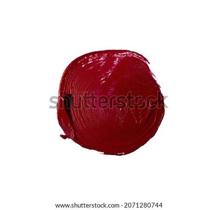 Round red smear of lipstick,isolated on white.Cosmetics swatch.