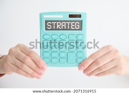 STRATEG on the calculator on the desktop, top view.