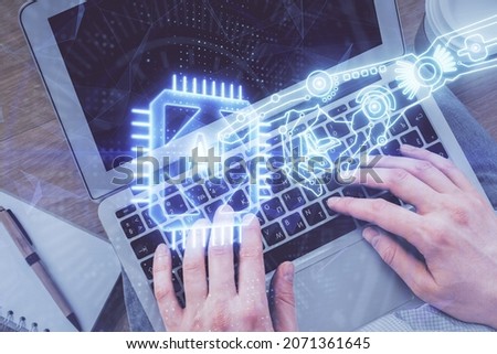 Multi exposure of man's hands typing over computer keyboard and data theme hologram drawing. Top view. Technology concept.