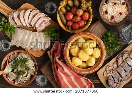 Festive table in the Russian village. Table set for dinner with traditional snacks and dishs of Russian cuisine. top view, flat lay Royalty-Free Stock Photo #2071377860
